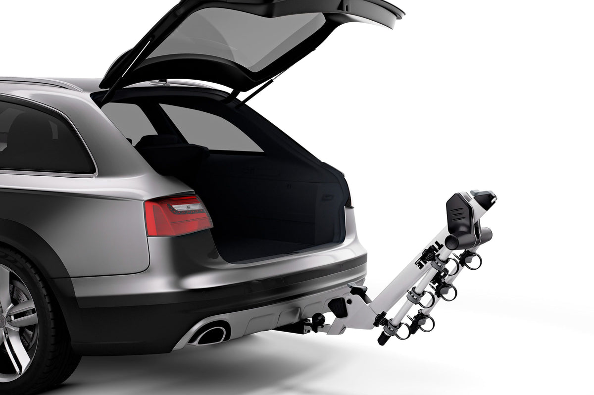 Thule Helium Pro 3 bike hitch rack mounted on silver Audi wagon with open tailgate