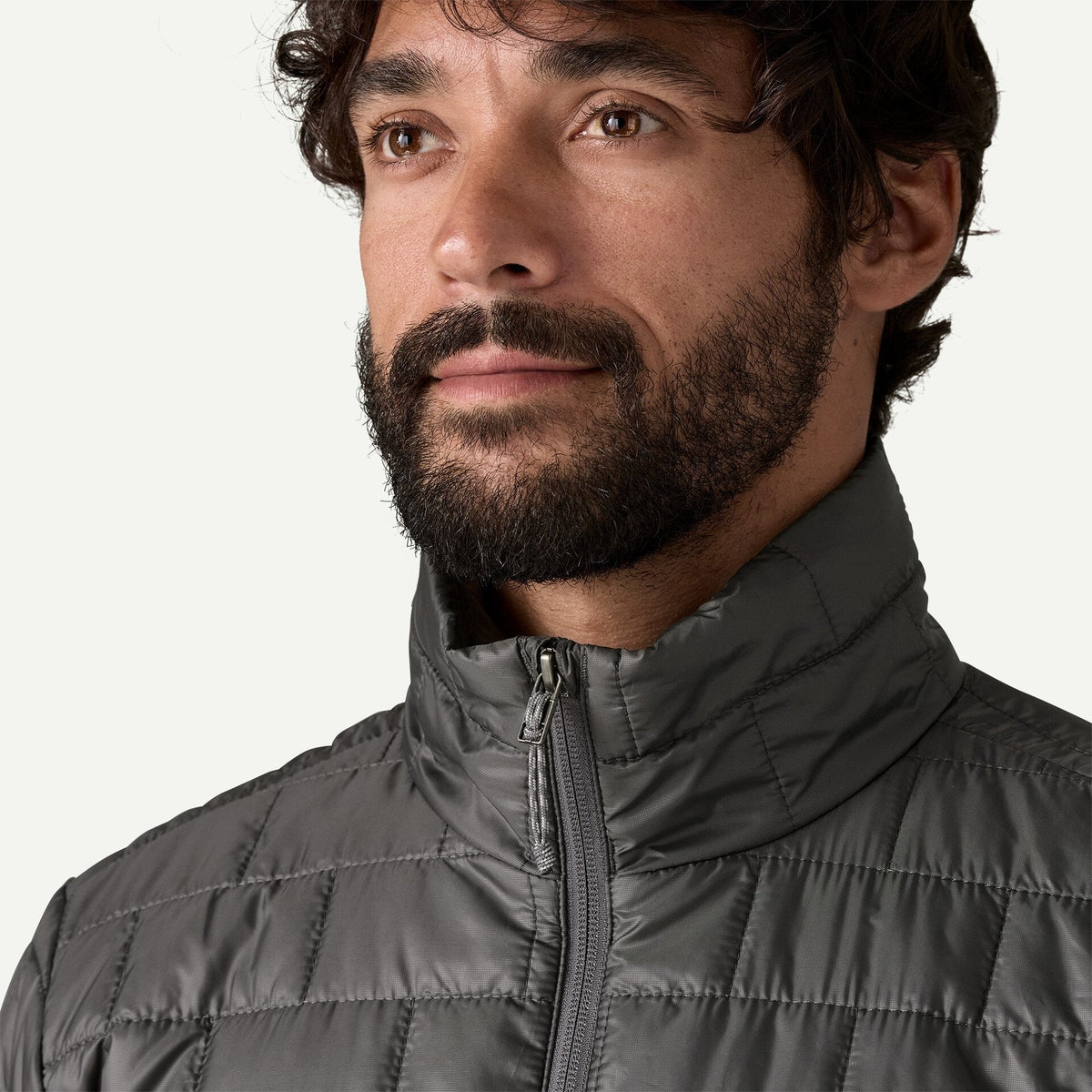 Close-up detail of Patagonia Nano Puff Jacket collar and zipper in Forge Grey