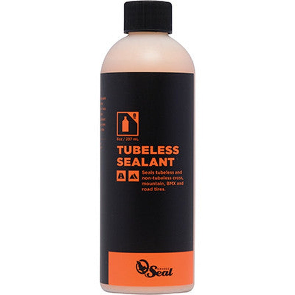 Orange Seal tubeless tire sealant bottle with black and orange label design