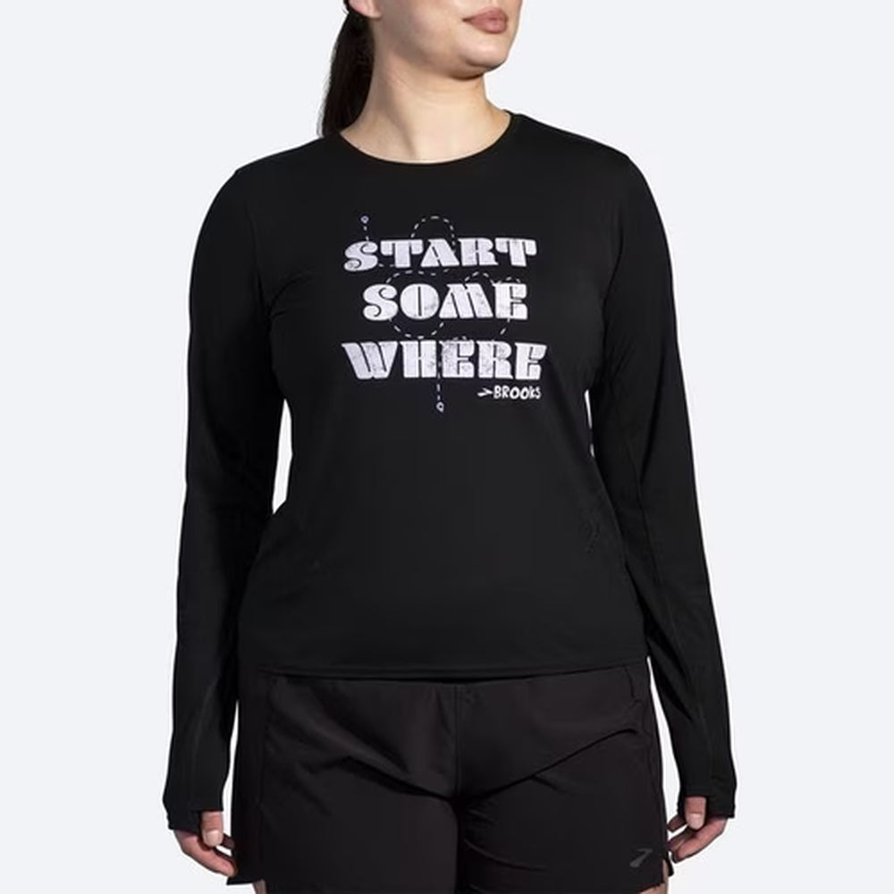 Brooks Distance Long Sleeve 3.0 in black with Start Somewhere graphic on female model