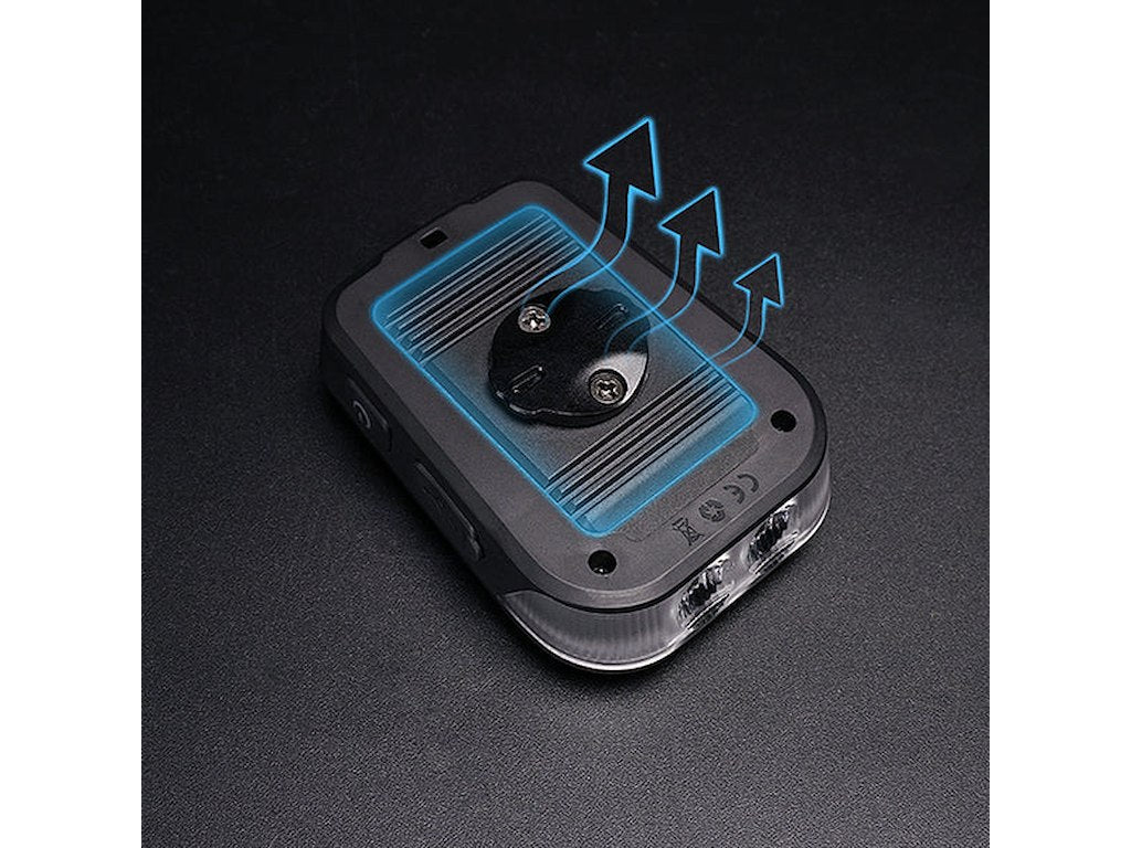Ravemen FR1100 bike front light showing solar panel and mounting mechanism with blue arrows