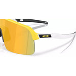 Close-up of Oakley Sutro Lite matte yellow frame with Prizm 24K gold lens and Oakley logo detail