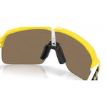 Close-up interior view of Oakley Sutro Lite matte yellow frame showing nose pad and lens back surface