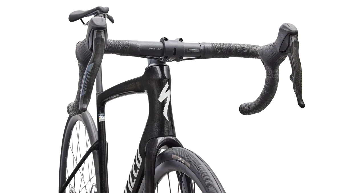 Close-up detail of Specialized Tarmac SL9 Comp handlebar, stem and cockpit area in charcoal