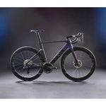 X-LAB AD9 road bike in Hawkeye Purple and Black colorway on studio background