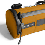 ALMSTHRE orange compact bar bag with black straps and logo label