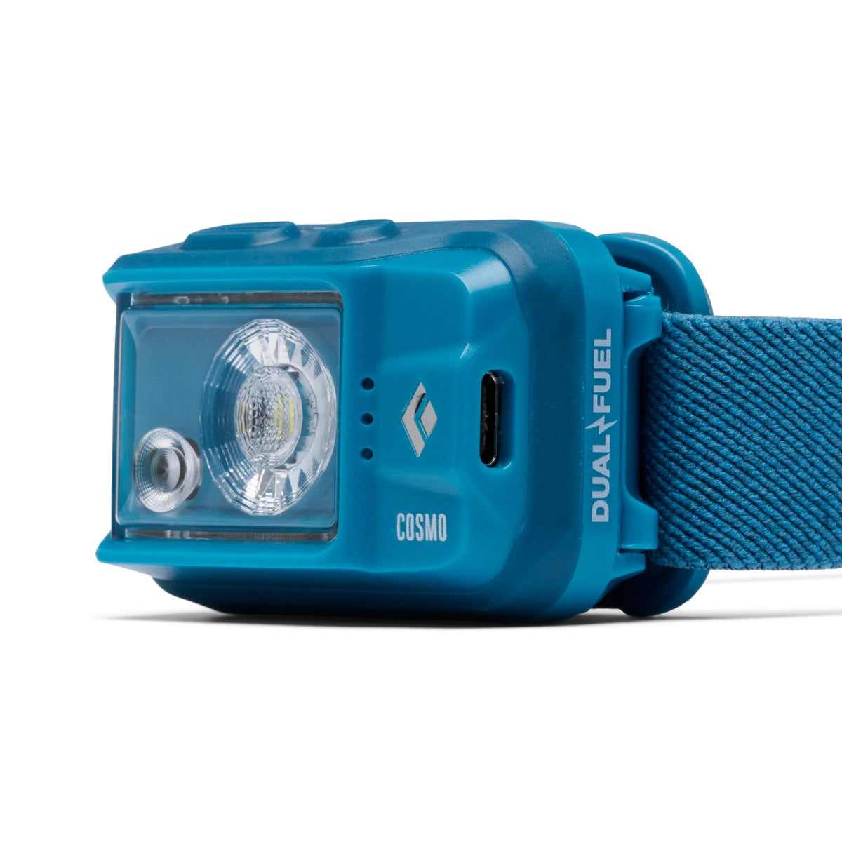 Black Diamond Cosmo Dual Fuel headlamp side view showing USB-C charging port in Desert Sky blue