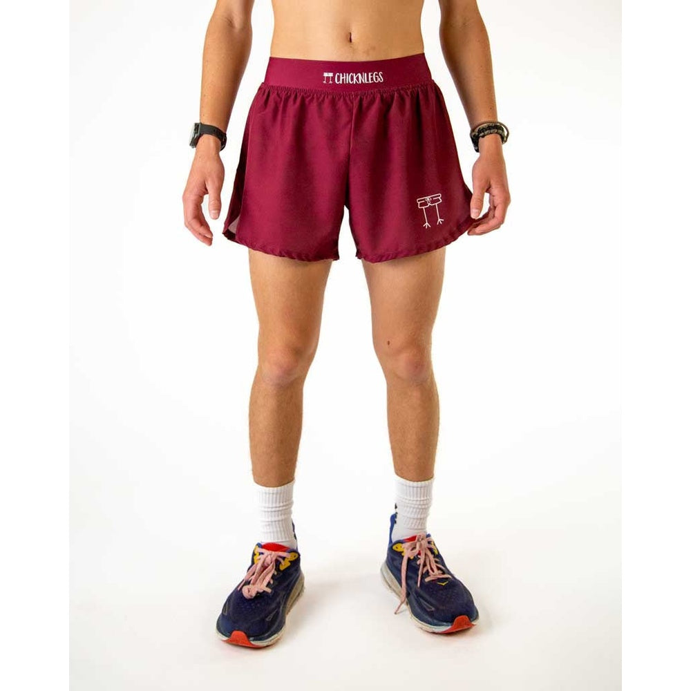 Man wearing ChicknLegs maroon athletic shorts with split hem design