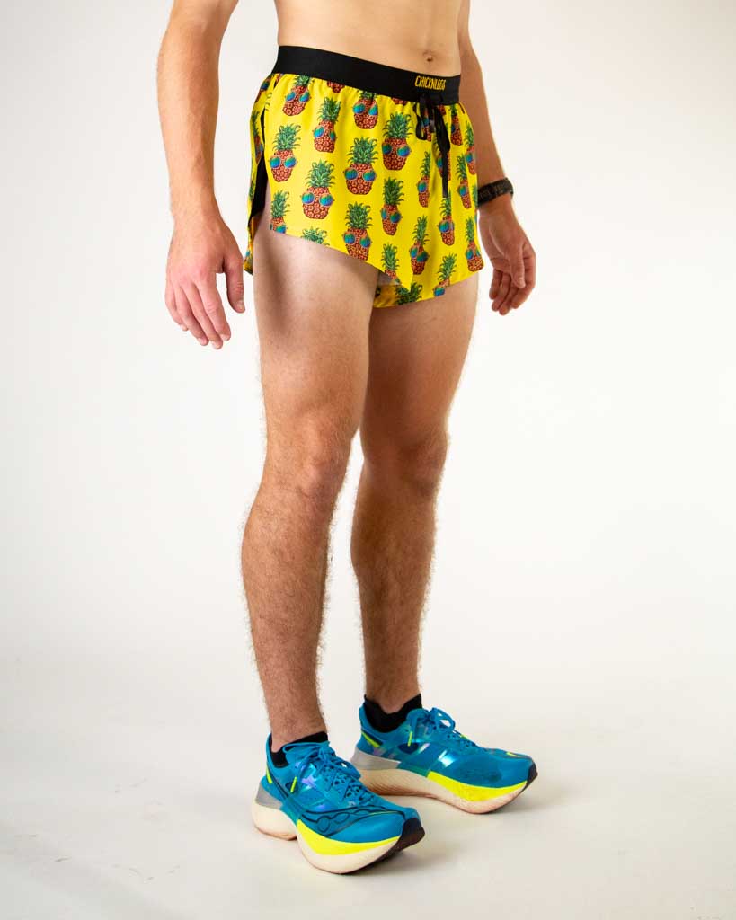 ChicknLegs 2-inch split running shorts in yellow Pineapple Express pattern worn by male model