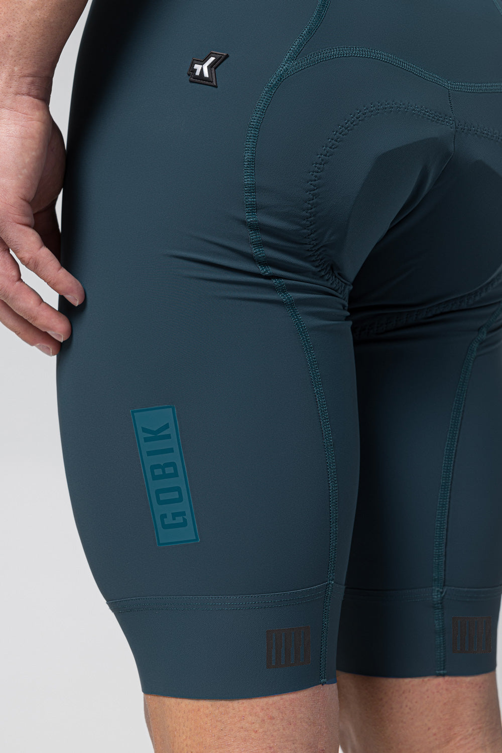 Gobik Matt 2.0 bib shorts in dark teal showing detailed construction and branding