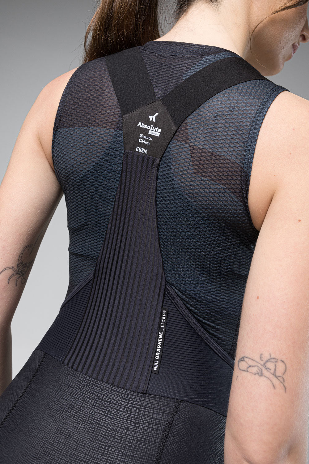 Gobik Absolute Women's cycling top back view showing graphene straps and mesh fabric in black