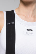 Detail shot of Gobik Limited mesh bib straps and Gobik Warm Project Unity white base layer chest