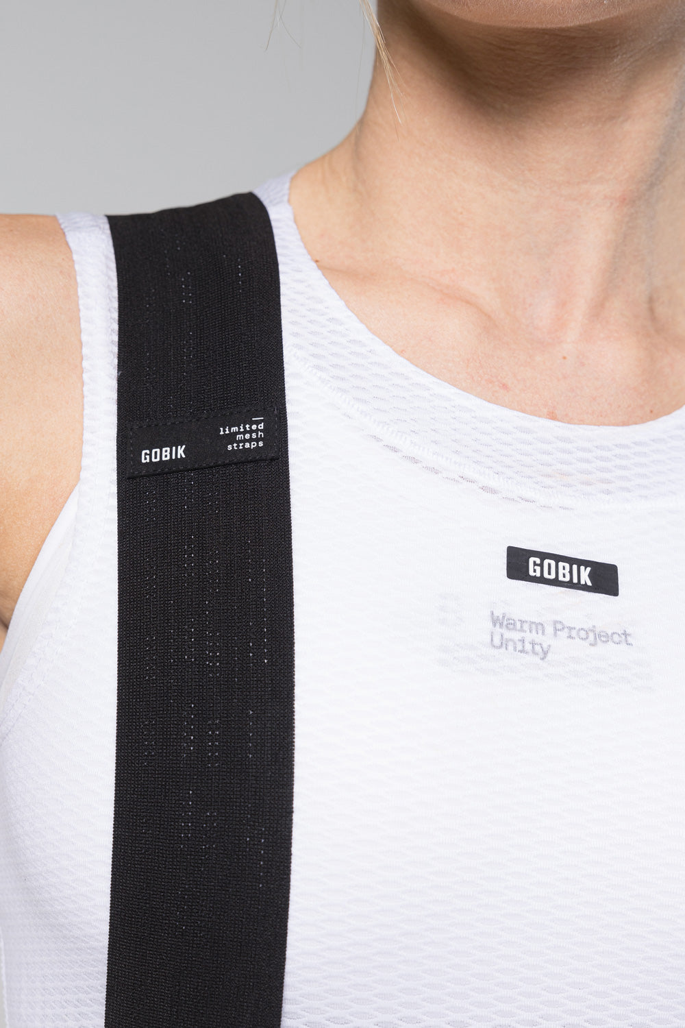 Detail shot of Gobik Limited mesh bib straps and Gobik Warm Project Unity white base layer chest
