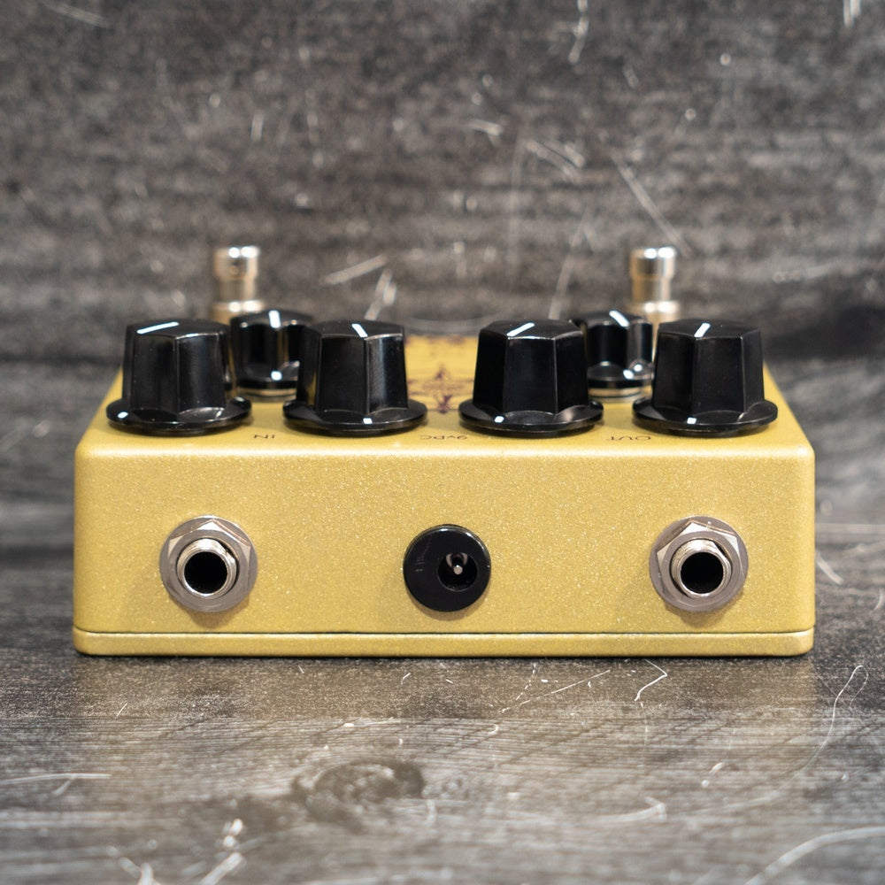 Bell Trace dual guitar effects pedal in gold metallic finish with four black knobs