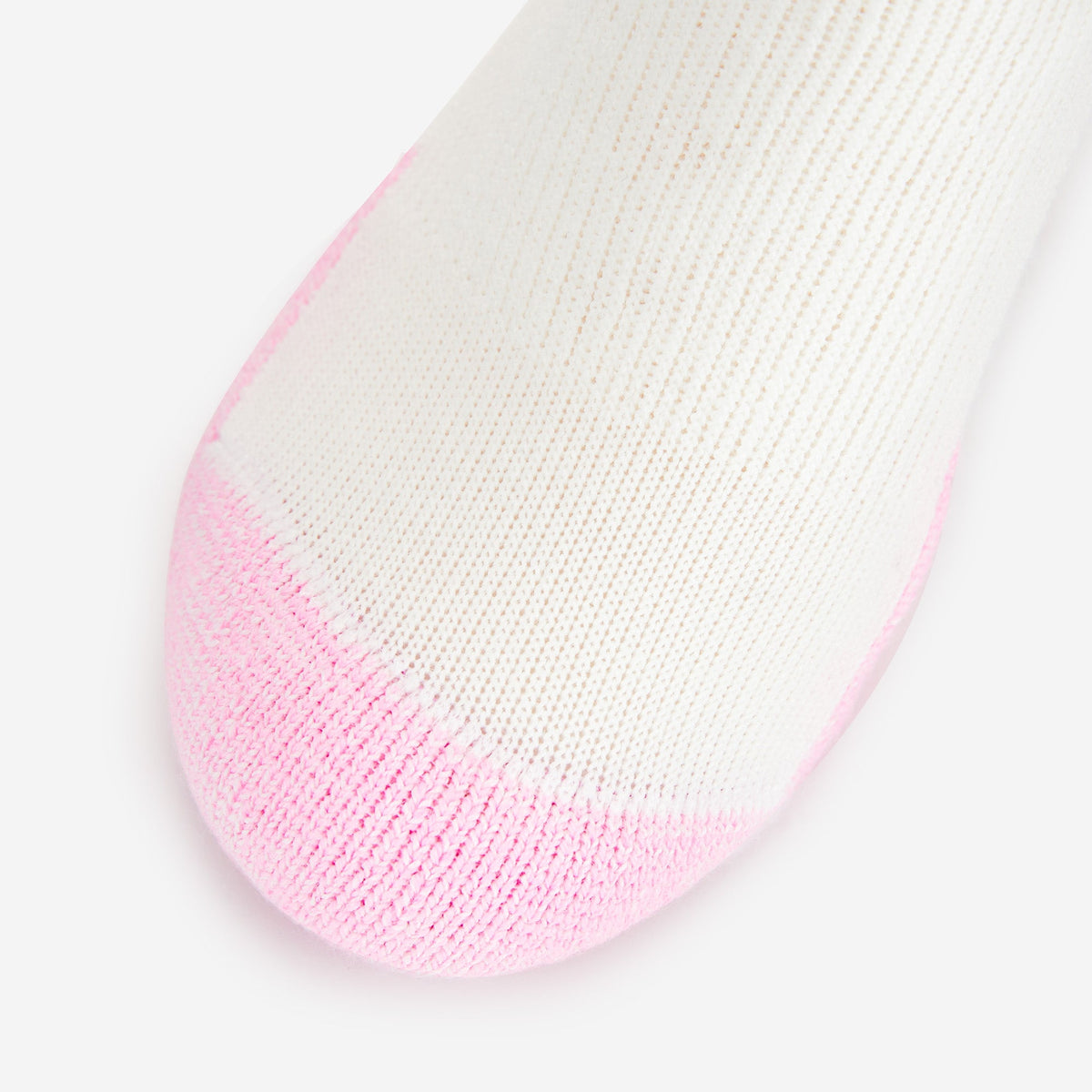 Thorlos women's white mini crew sock with pink padded toe cap close-up