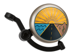 Electra bicycle bell with Linear Horizon design featuring sun rays, road, and landscape graphics