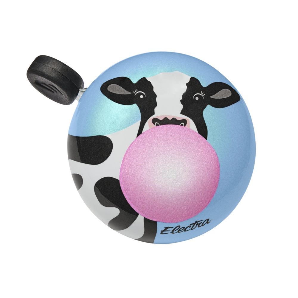 Electra bicycle bell with cow design blowing pink bubble gum on blue background