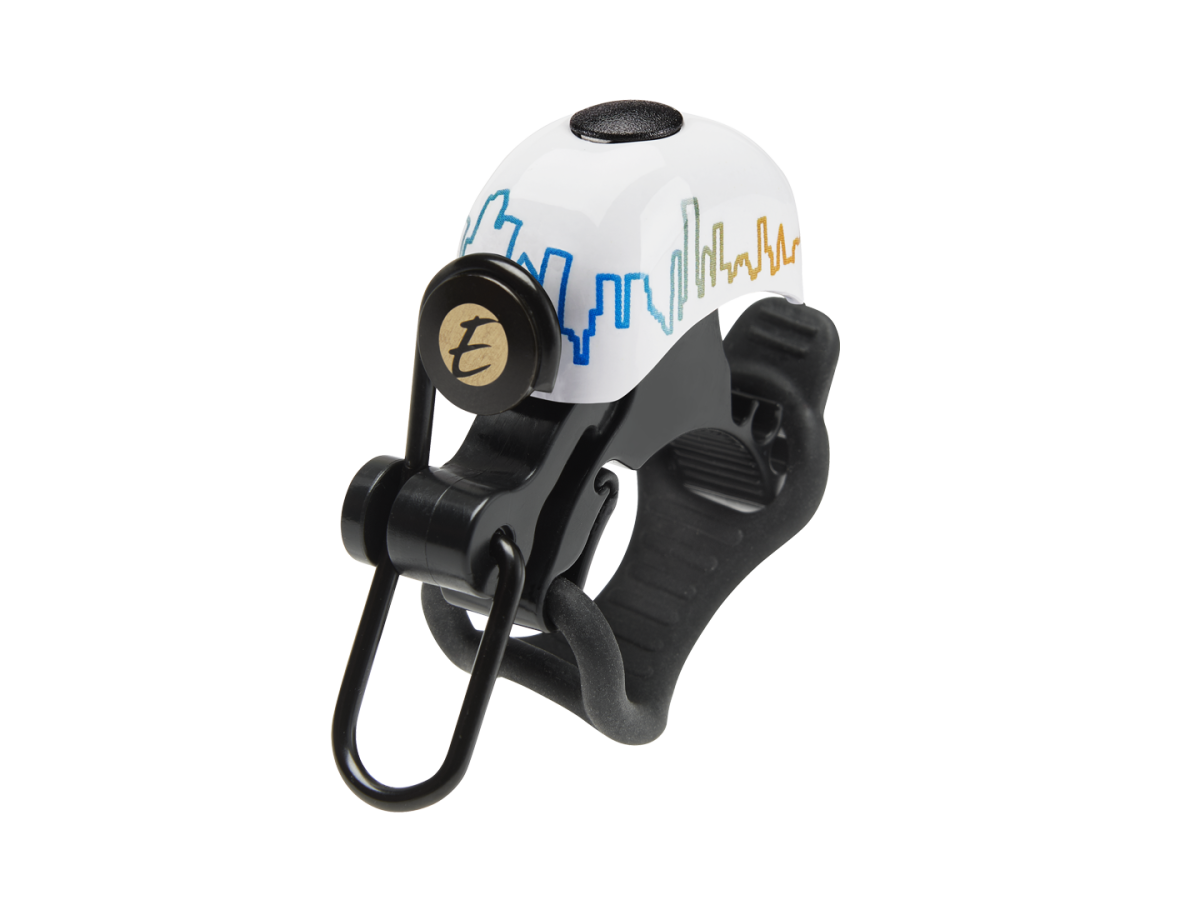 Electra bicycle bell with white dome featuring colorful skyline graphic and black mounting hardware