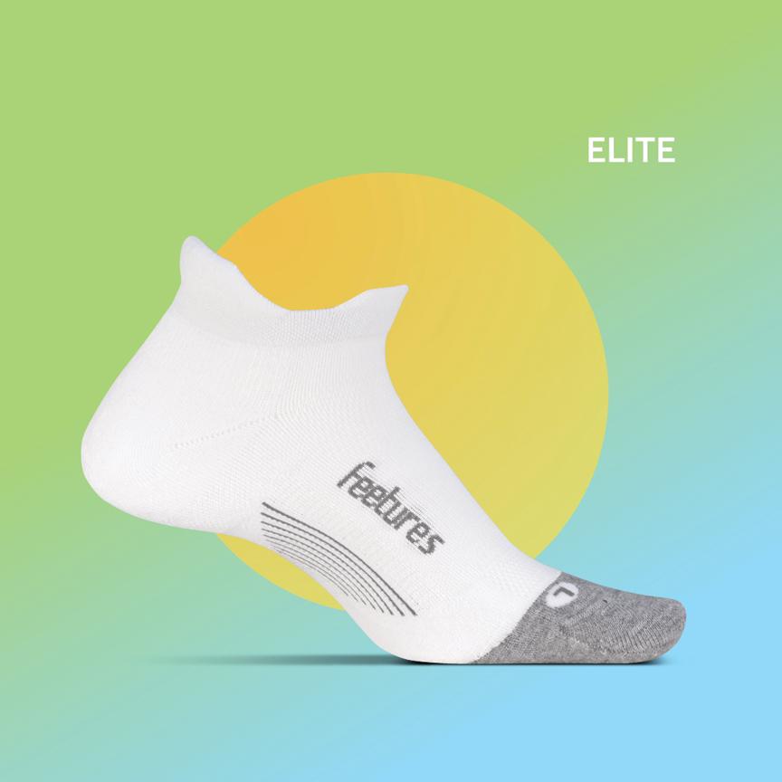 White Feetures Elite Max Cushion Tab running sock with grey accents on colorful background