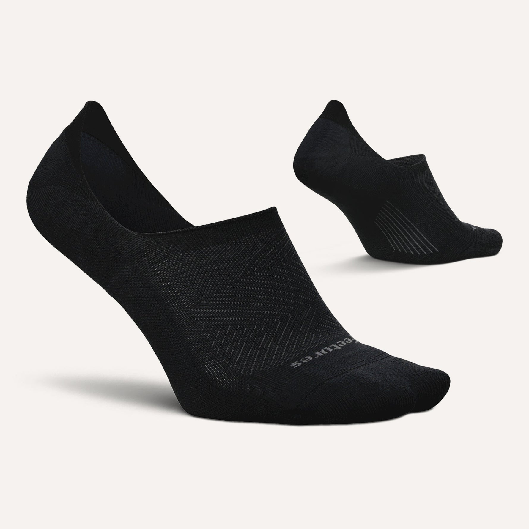 Two black Feetures Elite Light Cushion invisible no-show running socks on white background