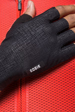 Black Gobik cycling gloves with crosshatch texture pattern and brand logo