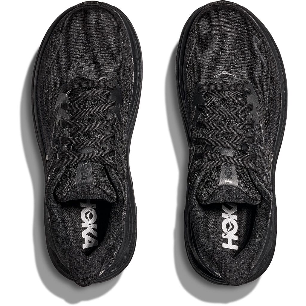 Hoka Clifton 10 Women's black running shoes top-down overhead view showing both shoes with HOKA insole