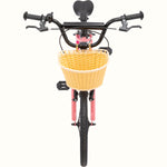 Retrospec Koda 20-inch kids bike in cotton candy pink with wicker front basket, front view