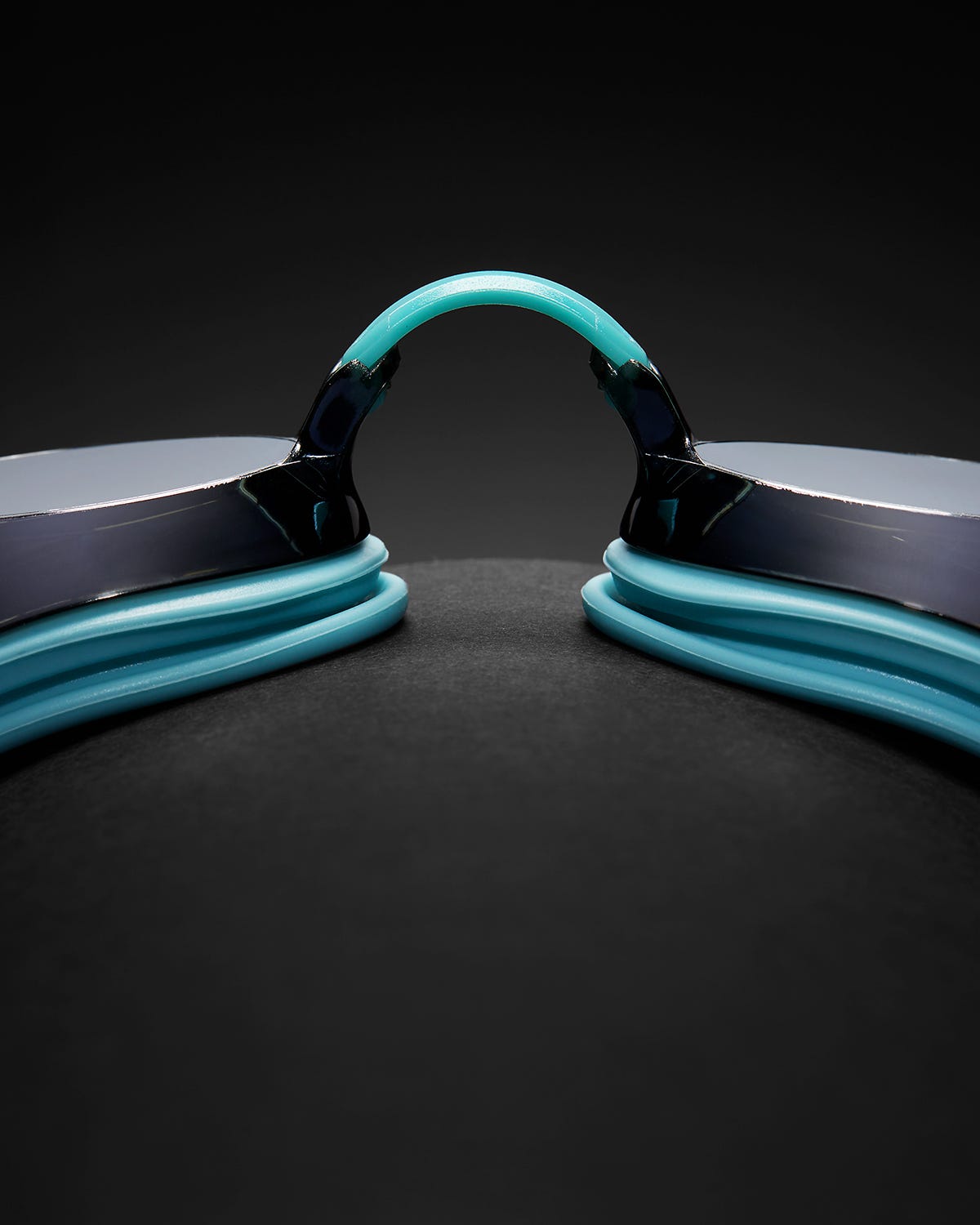 TYR Black Ops racing goggles with mirrored smoke lenses and teal straps