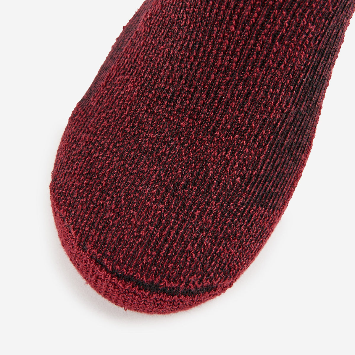 Thorlos hiking crew sock toe closeup in burgundy black marl knit fabric