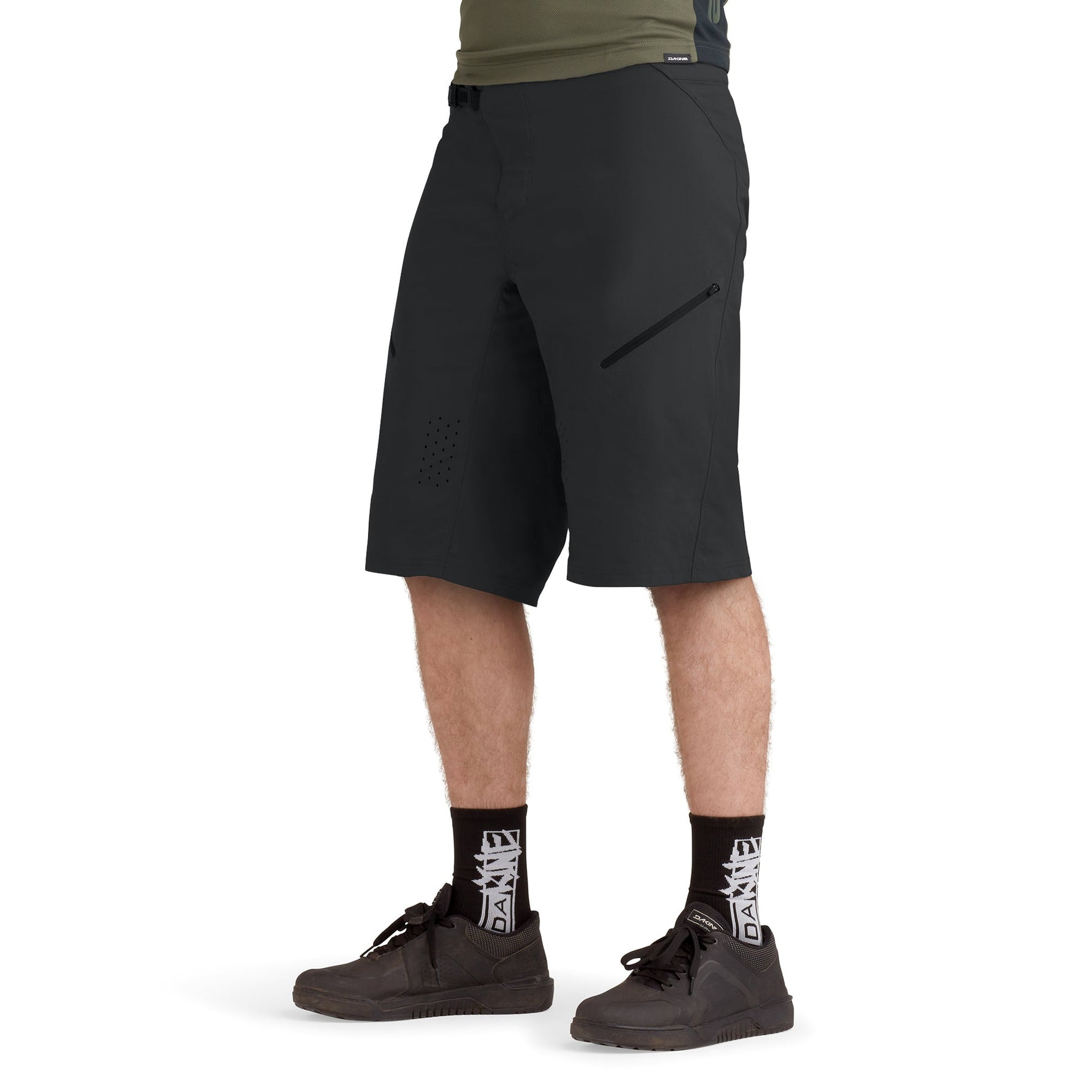 Man wearing black Dakine Vectra cycling shorts with zippered pocket and ventilation holes