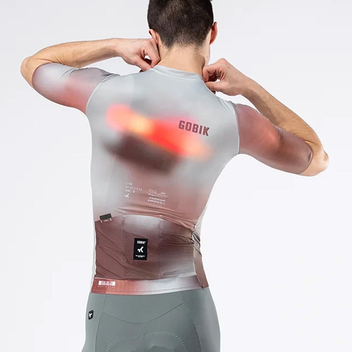 Rear view of male model wearing Gobik Attitude 2.0 jersey in Flank colorway showing back pockets