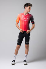 Male model wearing Gobik Odyssey cycling jersey in INEOS Grenadiers red team colors