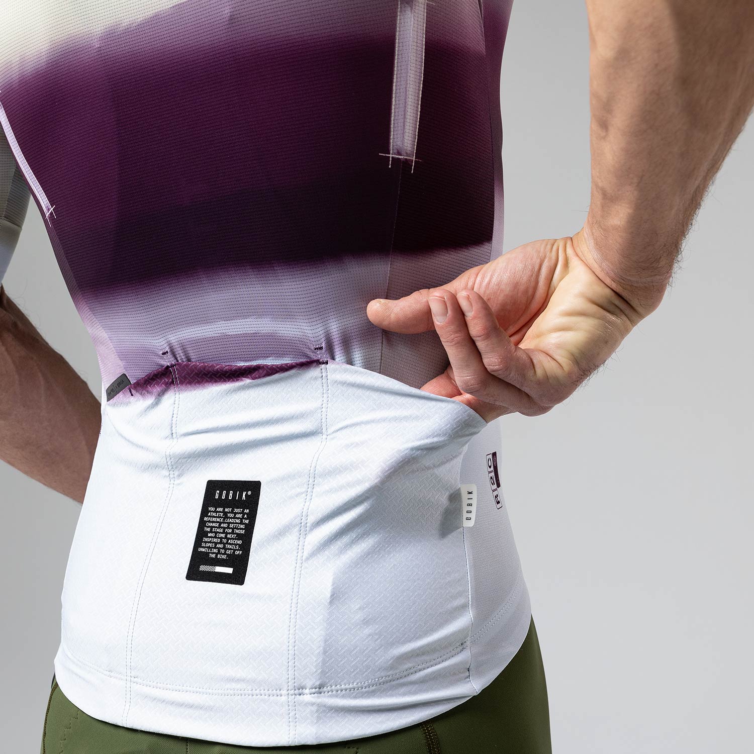 Gobik CX-Pro cycling jersey rear pocket detail in white and purple teaberry gradient