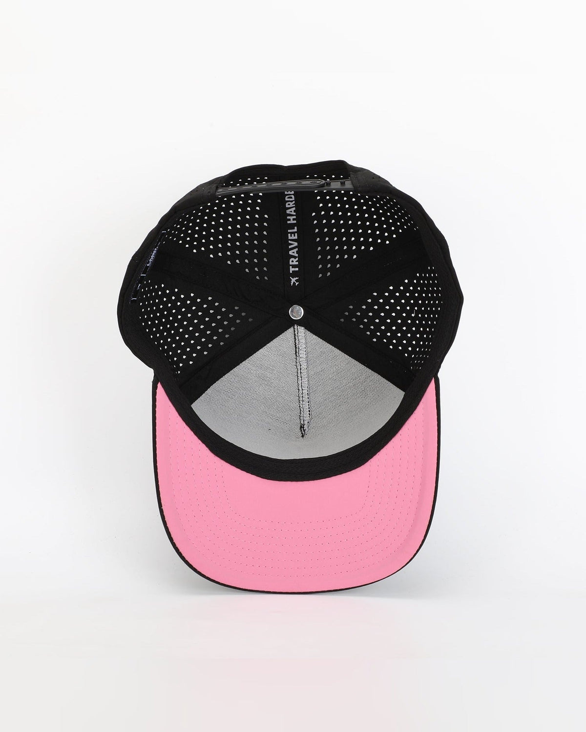 Interior view of Wrld Tags Miami black hat showing pink brim lining and perforated panels