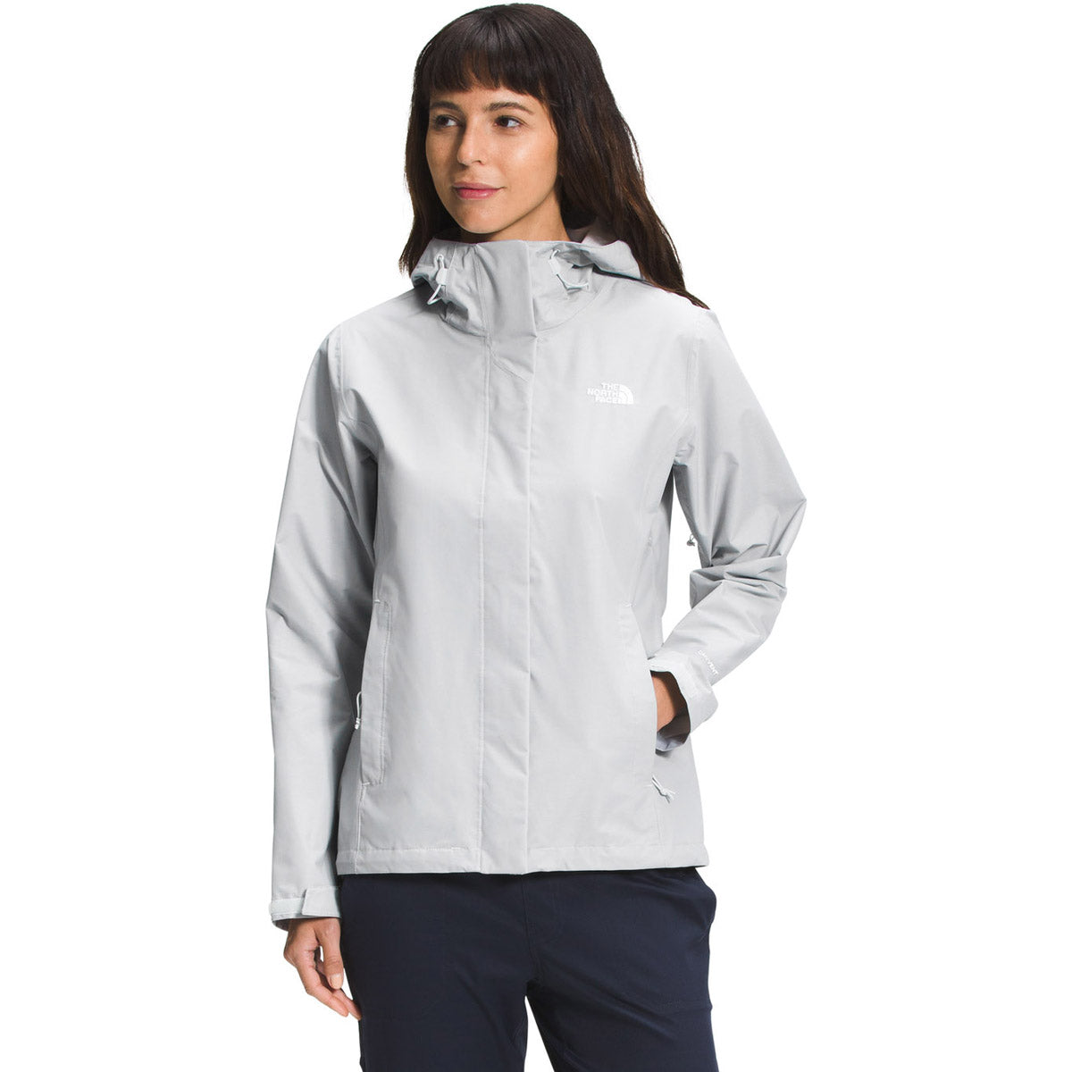 Woman wearing light grey North Face Venture 2 rain jacket with hood