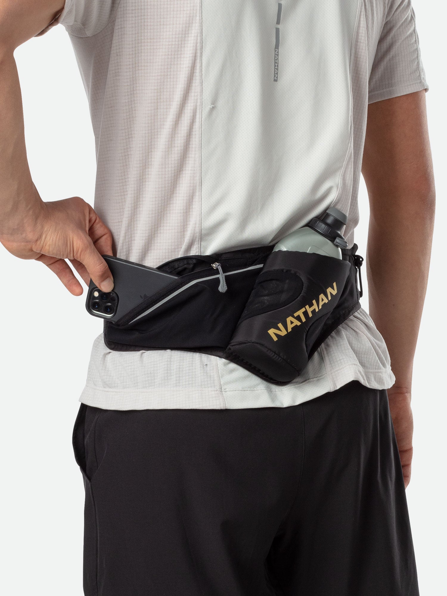 Nathan Peak Hydration Waist Pack in black worn around waist with phone storage
