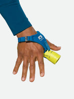 Nathan Polaris 200 R safety yellow hand torch with blue strap on runner's hand