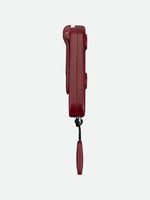 Nathan SaferRun Ripcord personal safety alarm in burgundy red with attached cord