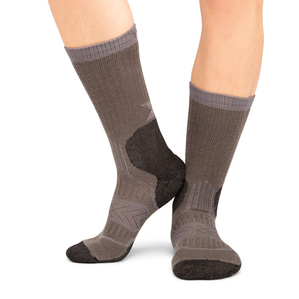 Thorlos Outdoor Crew socks in Silver Fox colorway shown on model's legs against white background