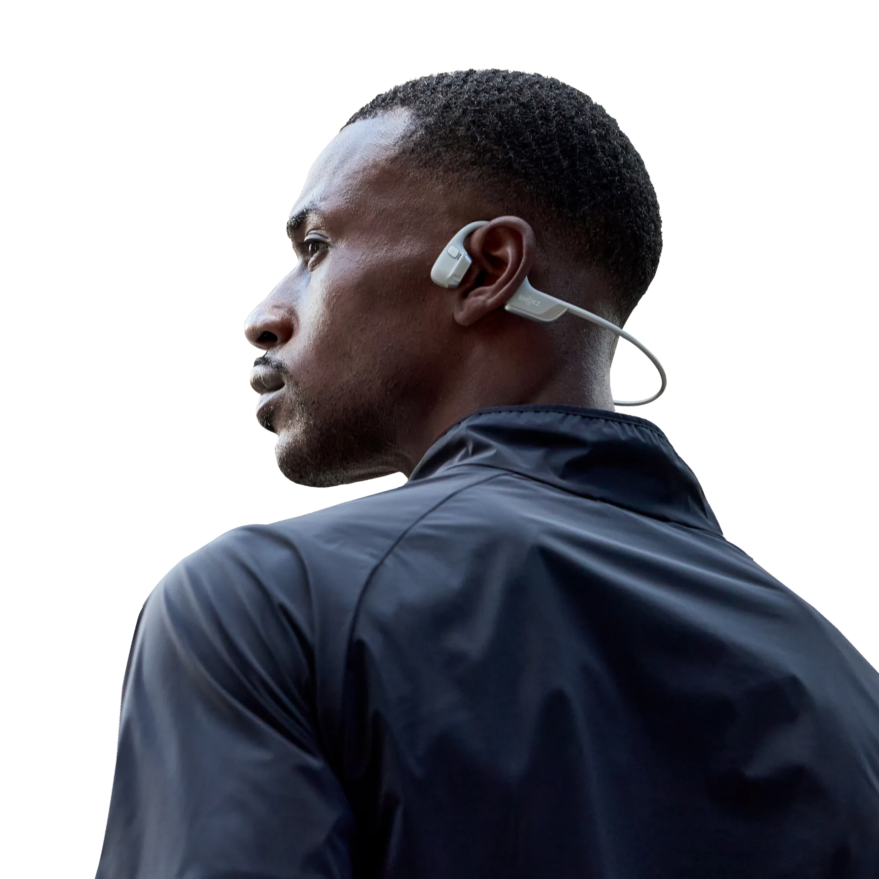 Man wearing white Shokz OpenRun Pro bone conduction headphones in profile view