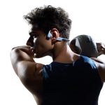 Athletic man wearing blue and white Shokz bone conduction headphones during workout