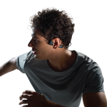 Man wearing black Shokz OpenRun Pro 2 bone conduction headphones while exercising