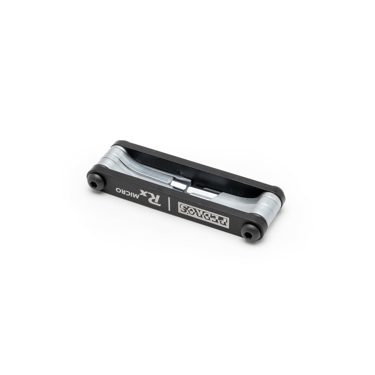 Pedro's RX Micro multi-tool in black and silver, compact folding design on white background