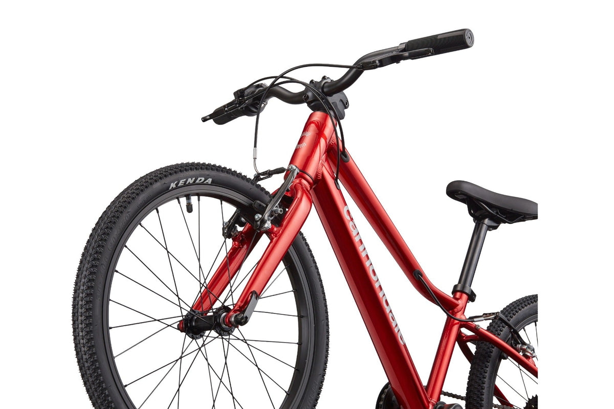Front fork and handlebar detail of Cannondale Kids Quick C2 in metallic red with Kenda tire
