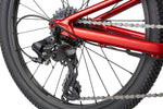 Detail shot of Cannondale Kids Quick C2 rear derailleur, cassette, and chain on metallic red frame