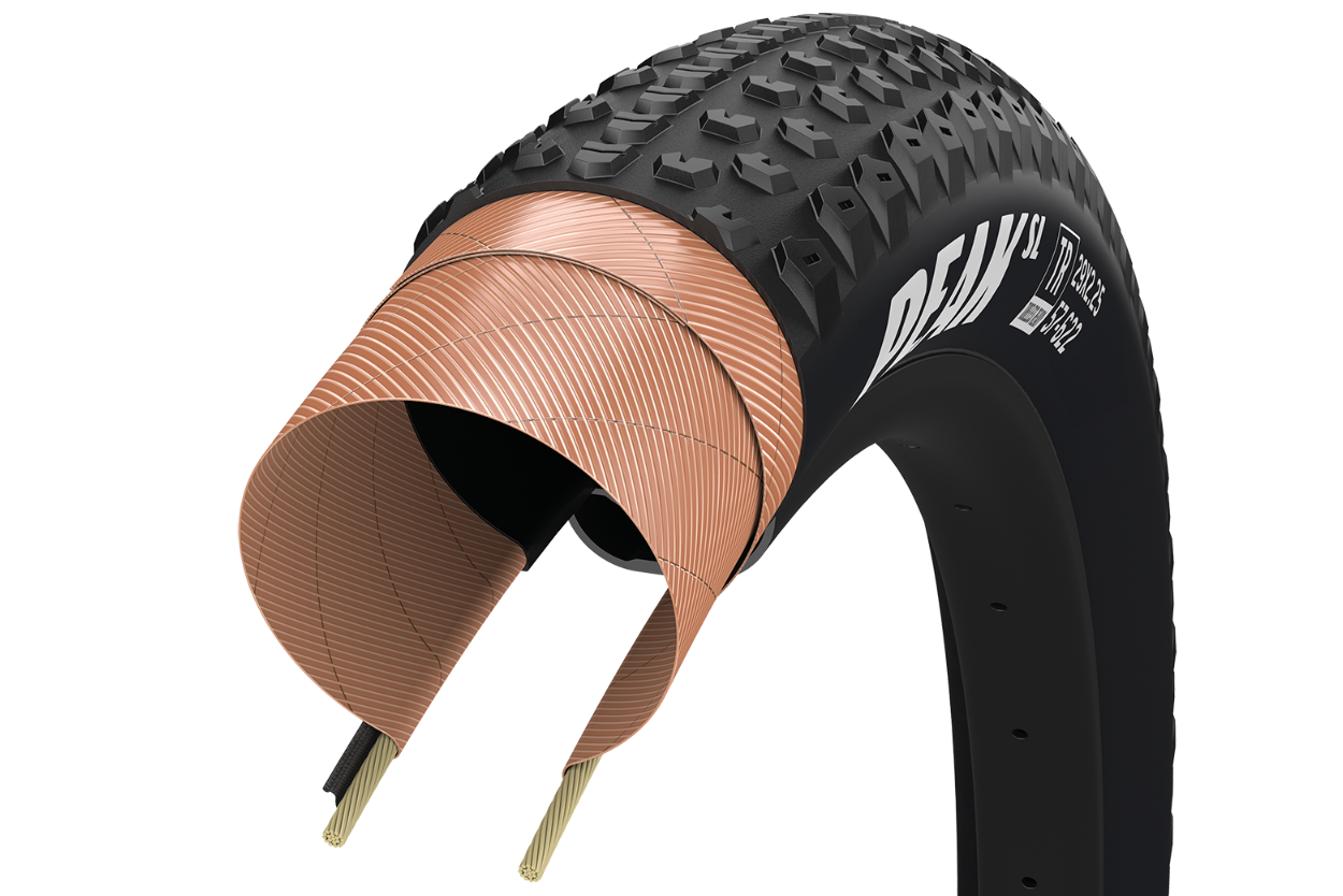 Goodyear Peak SL Race black mountain bike tire with cutaway showing internal construction