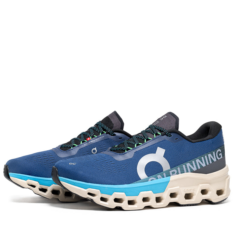 On Cloudmonster 2 running shoes in blue and gray colorway with distinctive sole