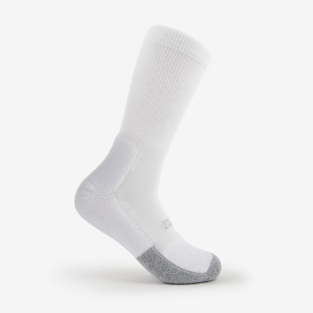 Thorlos unisex white tennis crew sock showing arch support and gray toe cap, side view