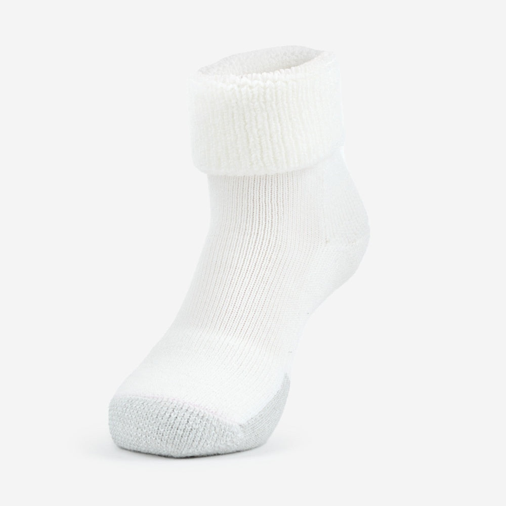 Thorlos white tennis cuff sock with gray cushioned heel and toe on foot form