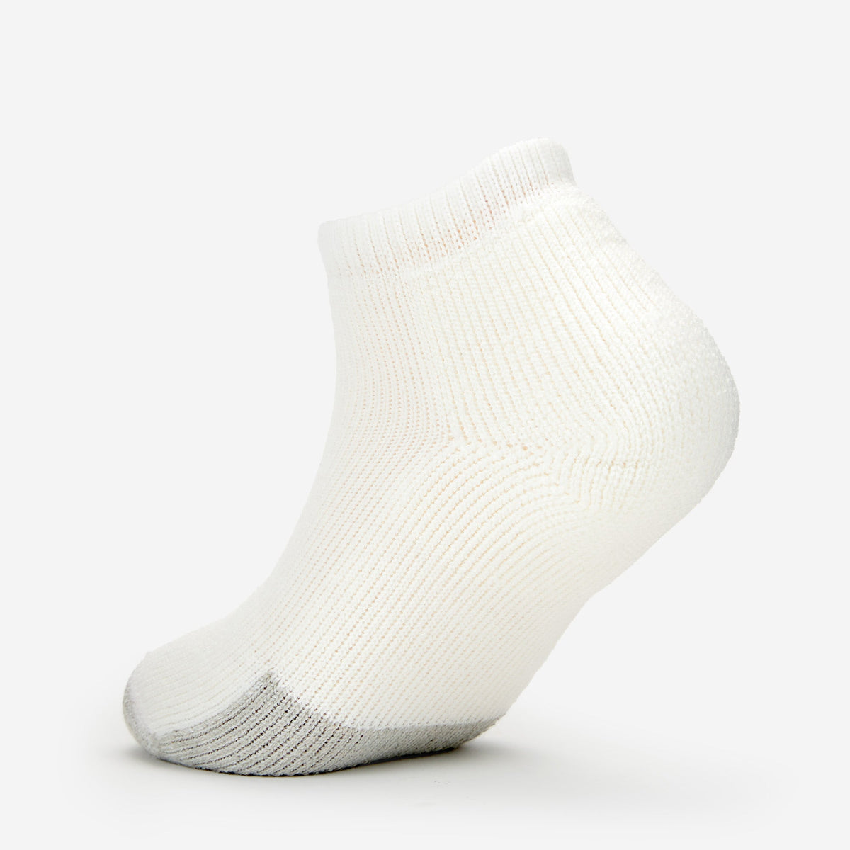 Thorlos white ankle tennis sock with gray toe cushioning on clean background